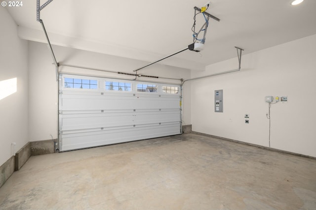 garage with electric panel and a garage door opener