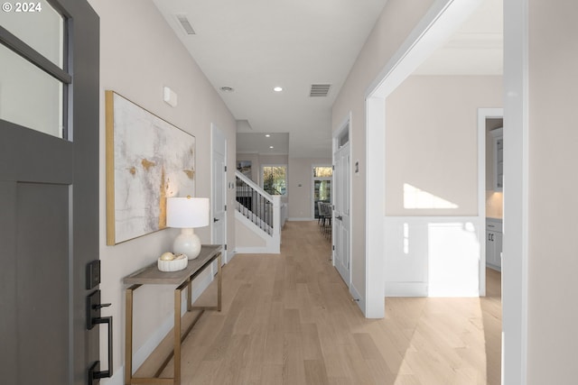 corridor featuring light hardwood / wood-style flooring