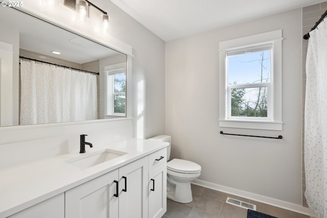 bathroom featuring a shower with shower curtain, tile patterned floors, vanity, and toilet