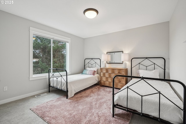 carpeted bedroom featuring radiator