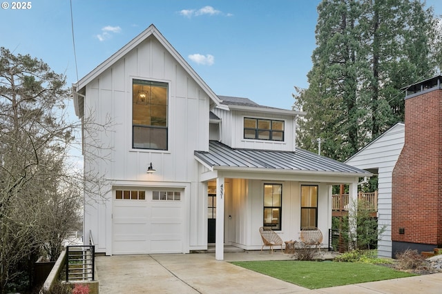 modern farmhouse with covered porch and a garage