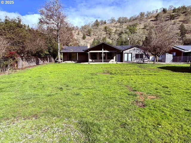 single story home with a front lawn and a garage