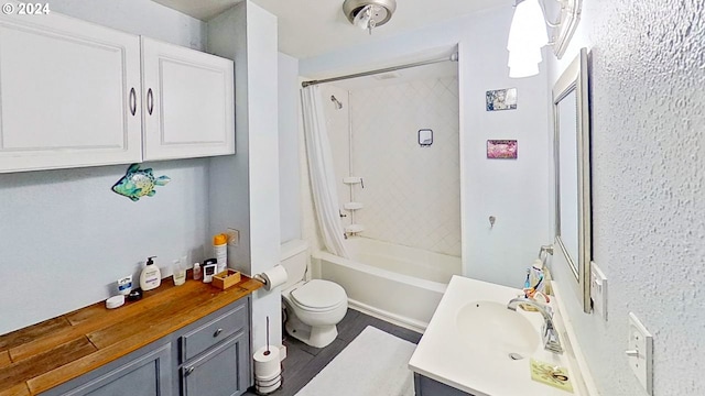 full bathroom featuring vanity, wood-type flooring, shower / tub combo, and toilet