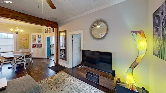 living room with ornamental molding, ceiling fan with notable chandelier, and dark wood-type flooring