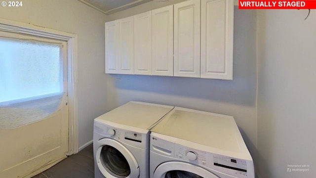 laundry room featuring cabinets and separate washer and dryer