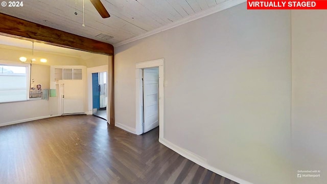 empty room featuring ceiling fan, crown molding, and dark hardwood / wood-style floors