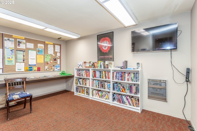 interior space with baseboards and heating unit