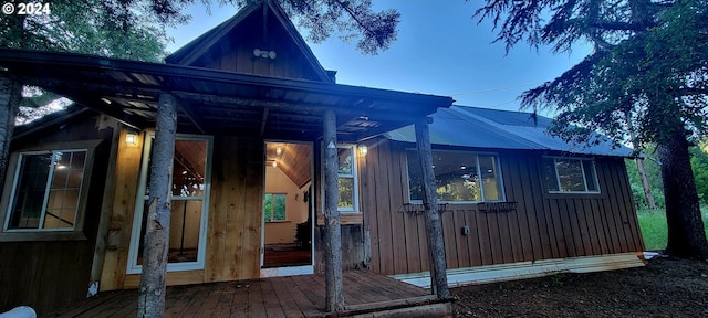 view of property exterior featuring a wooden deck