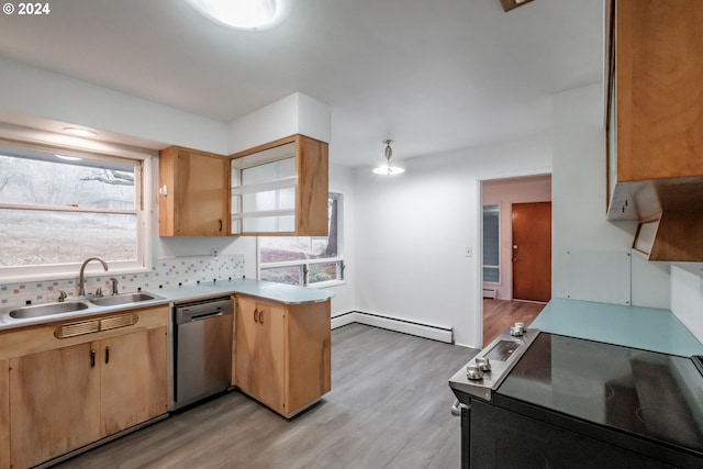 kitchen featuring sink, stainless steel appliances, a baseboard radiator, decorative backsplash, and light wood-type flooring