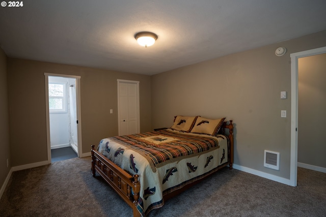 bedroom featuring dark carpet