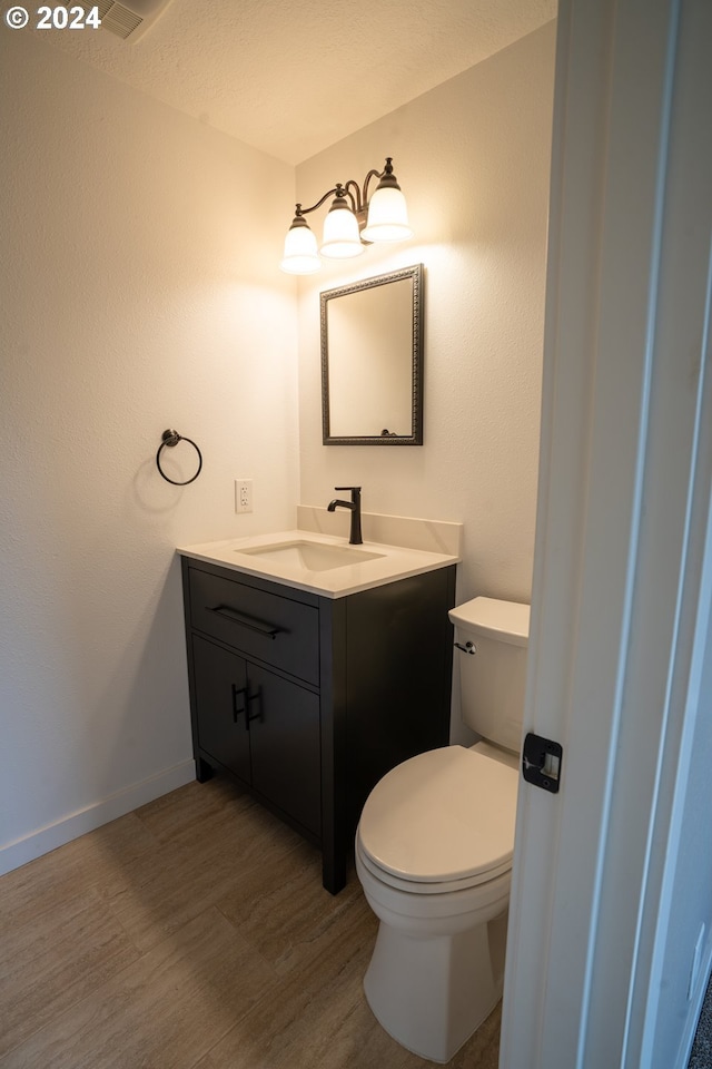 37075 Camp Creek Rd, Springfield, OR 97478 - half bathroom featuring vanity and wood finished floors