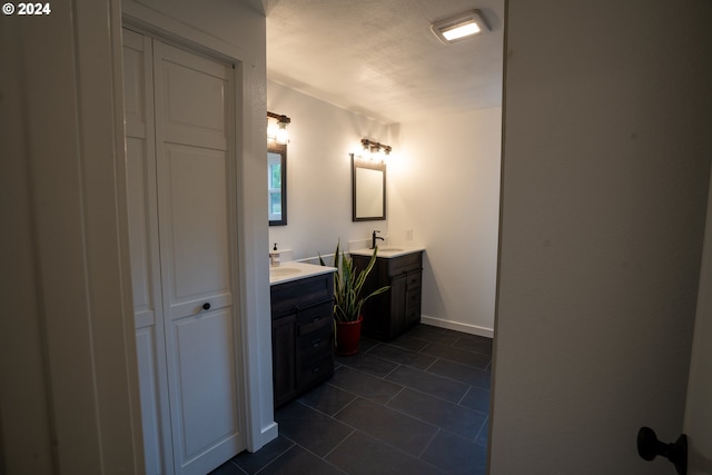 bathroom with vanity and tile patterned floors