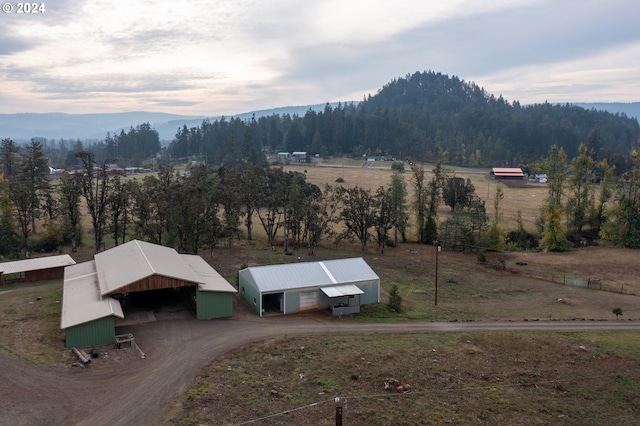 drone / aerial view featuring a mountain view and a rural view