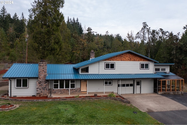 37075 Camp Creek Rd, Springfield, OR 97478 - view of front of home featuring a chimney, a garage, a front lawn, driveway, and a wooded view