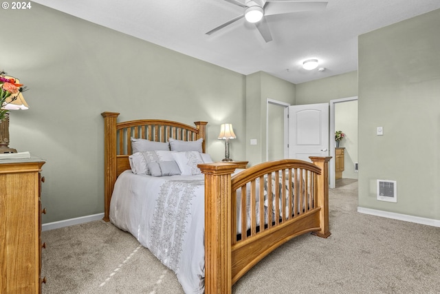 bedroom with light carpet and ceiling fan