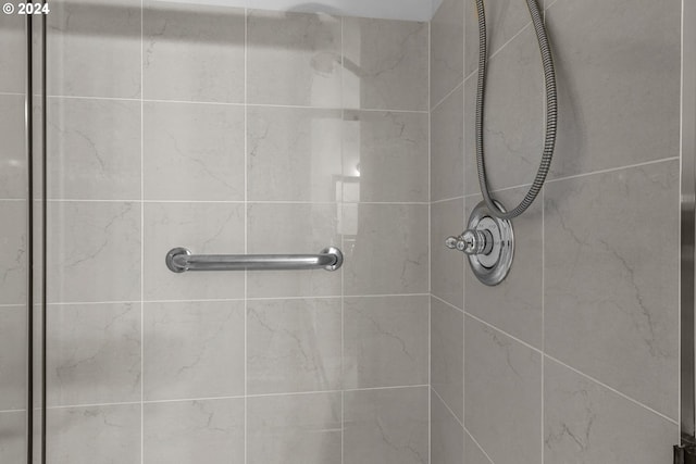 bathroom with a tile shower