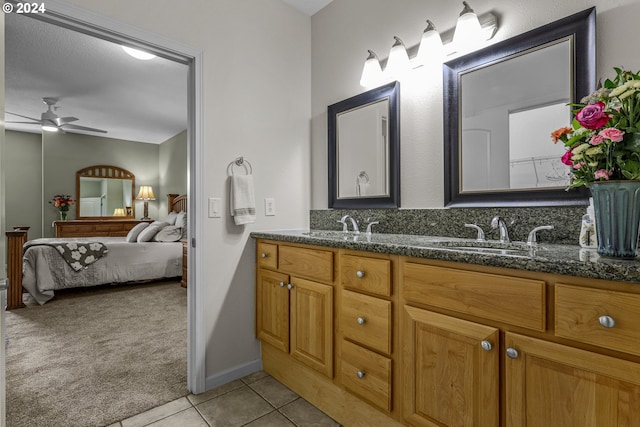 bathroom featuring ceiling fan, vanity, and tile patterned flooring