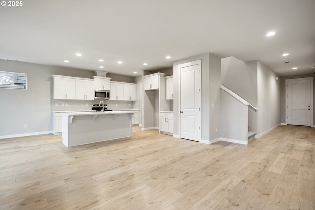 interior details with a tile fireplace and hardwood / wood-style floors