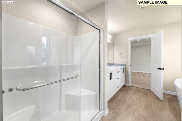 bathroom with vanity and an enclosed shower