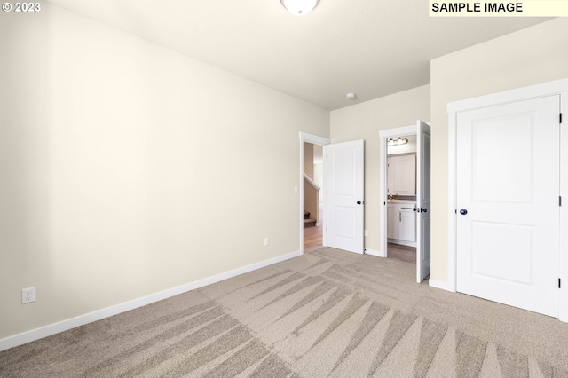 unfurnished bedroom featuring light colored carpet