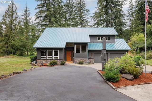 view of front facade with a front lawn and a garage