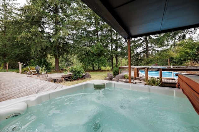 view of swimming pool with a deck