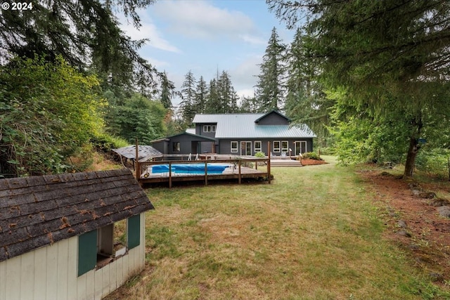 view of yard featuring a pergola and a swimming pool side deck