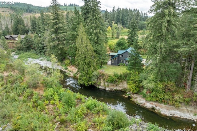 birds eye view of property featuring a water view