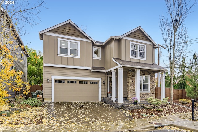 craftsman-style home with a garage