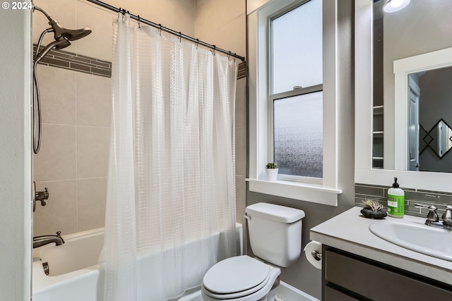 full bathroom with shower / tub combo, vanity, and toilet