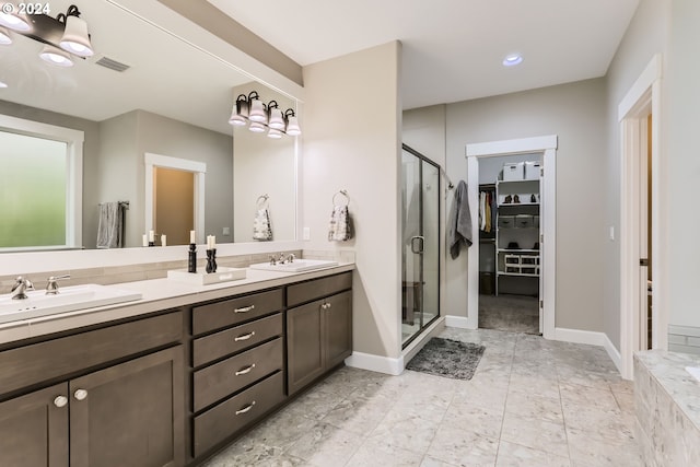 bathroom featuring vanity and a shower with shower door