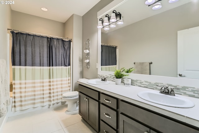 full bathroom with toilet, vanity, tile patterned floors, and shower / bath combo with shower curtain