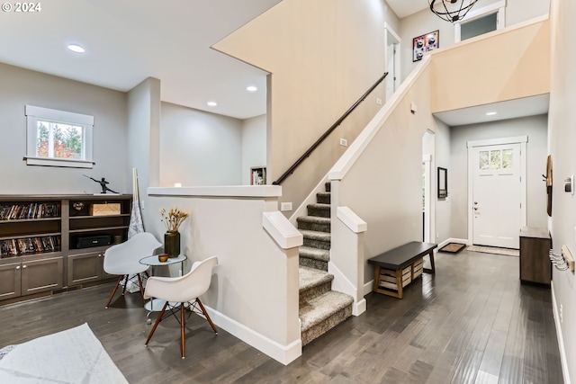 stairway featuring wood-type flooring