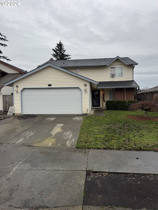 view of front facade with a porch, a garage, and a front lawn