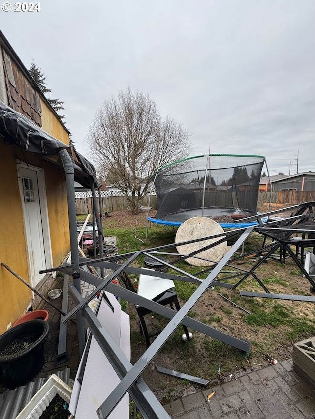 view of yard with a trampoline