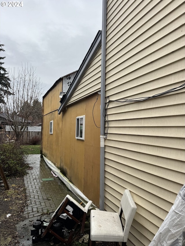 view of side of home featuring a patio area