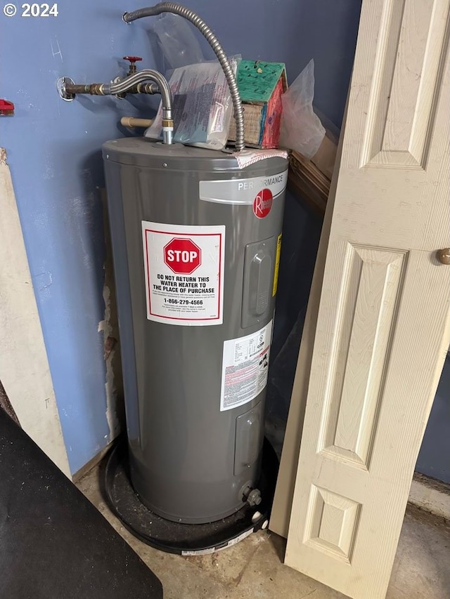 utility room featuring electric water heater