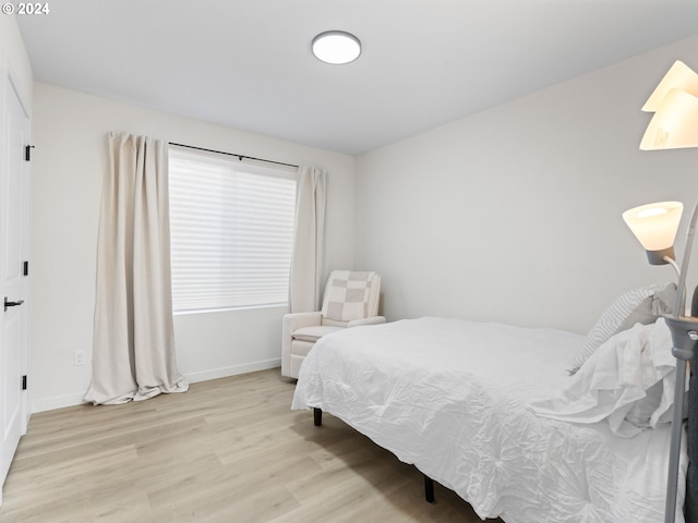 bedroom with light hardwood / wood-style flooring