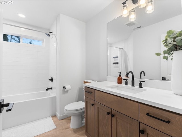 full bathroom featuring toilet, vanity, shower / tub combo with curtain, and hardwood / wood-style flooring