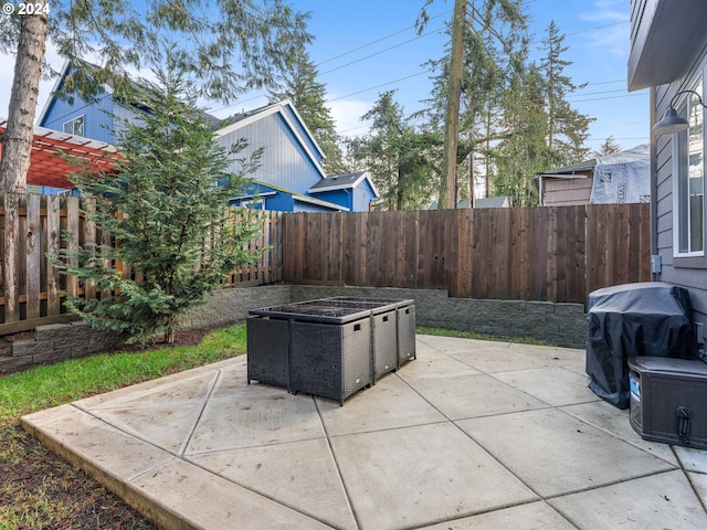 view of patio featuring a grill