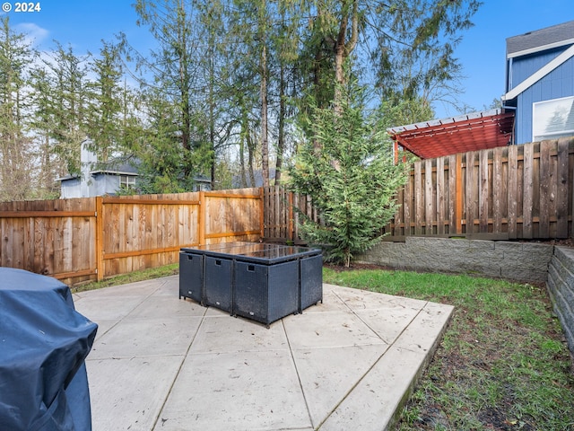 view of patio / terrace with an outdoor hangout area, a grill, and a fenced backyard