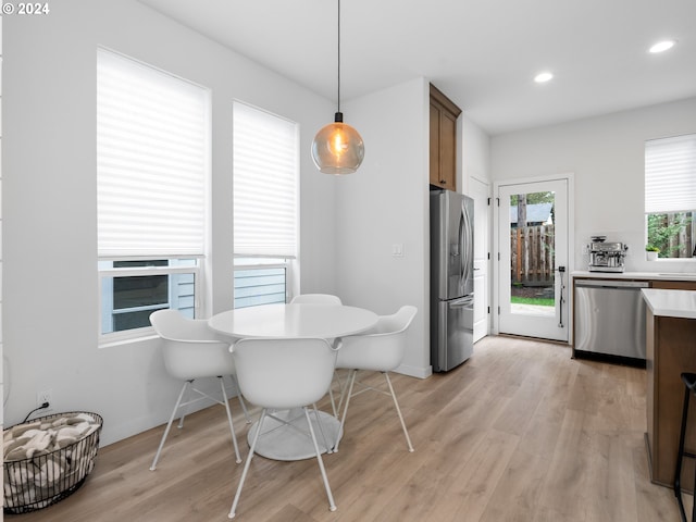 dining room with light wood-type flooring