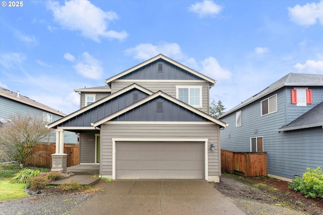 view of front of home featuring driveway, a garage, fence, and board and batten siding