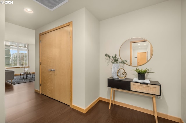 hallway featuring dark wood-type flooring