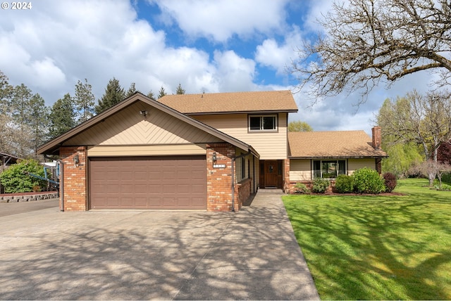 view of front of home with a front yard and a garage