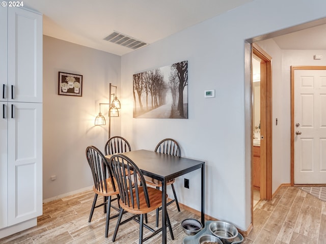 dining space featuring light hardwood / wood-style floors