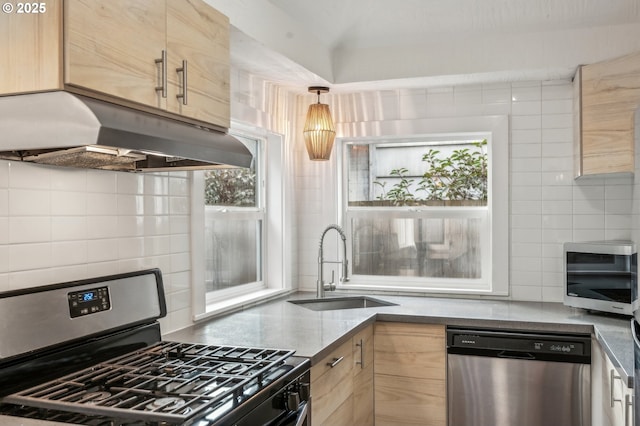 kitchen featuring sink, light brown cabinets, backsplash, and stainless steel appliances