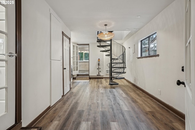 hall with hardwood / wood-style flooring