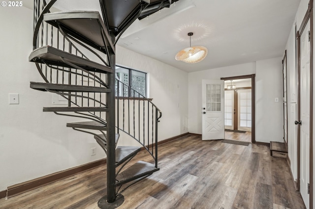 foyer featuring wood-type flooring and french doors