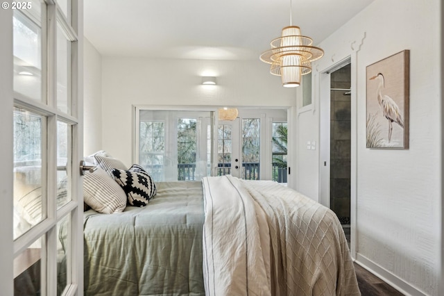 bedroom featuring hardwood / wood-style flooring and access to outside